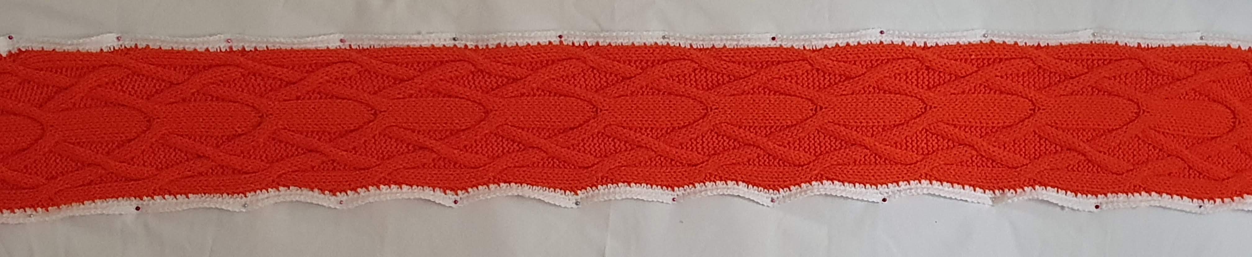 Orange with a central band that forks into two and then crosses on the outside edge