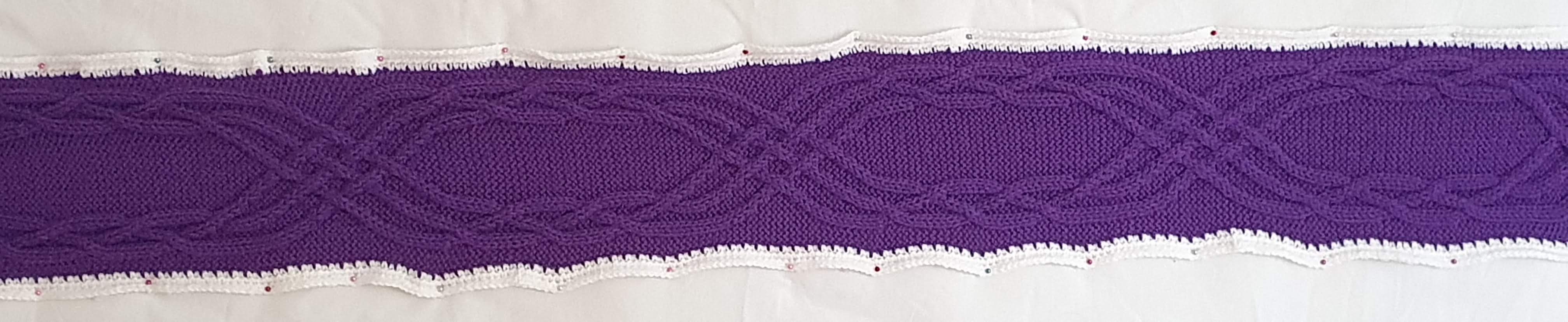 Purple with six strands in two groups of three, plaiting amongst themselves at either side, then weaving through the other group of three strands