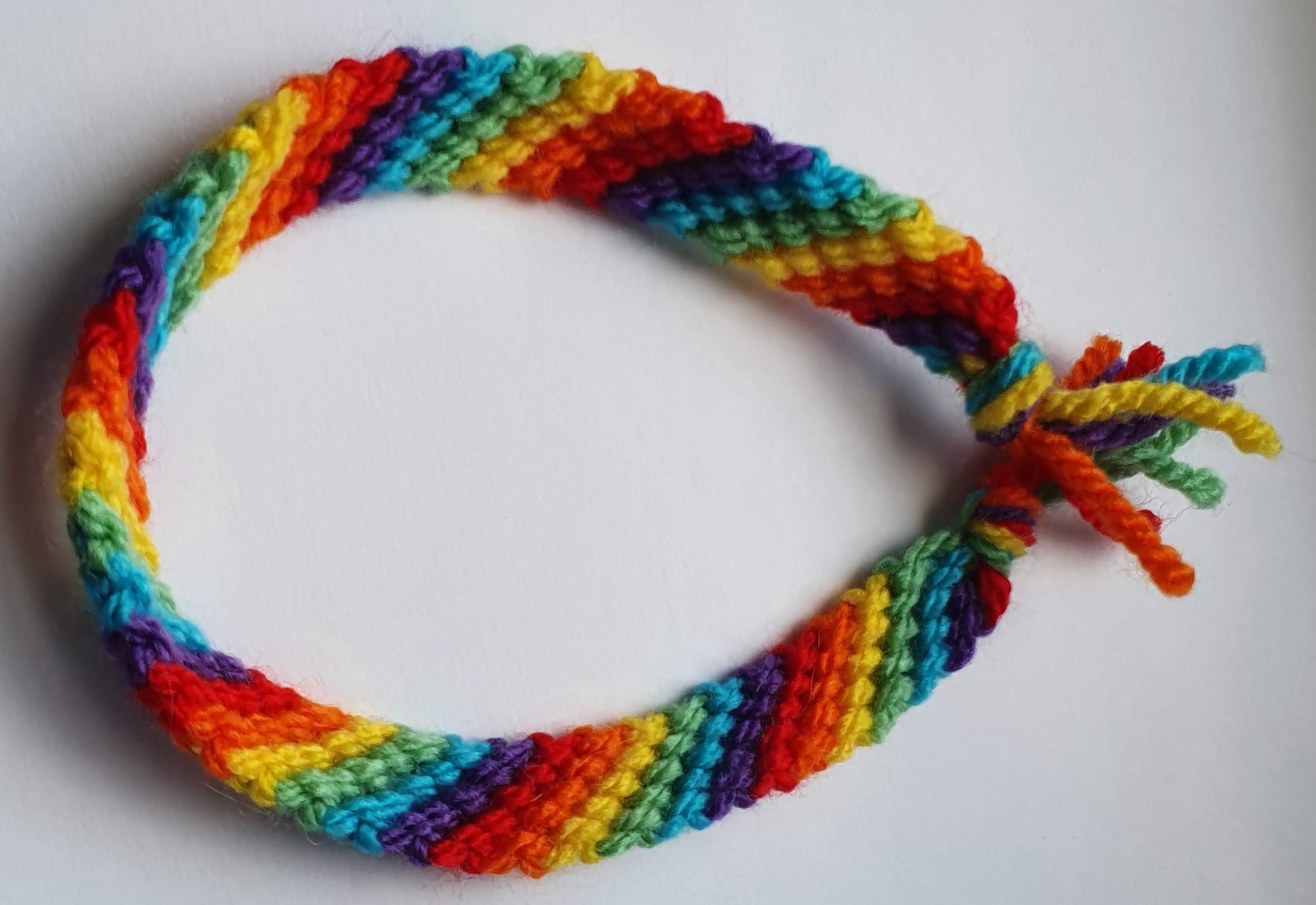 Curled up bracelet with rainbow diagonal stripes