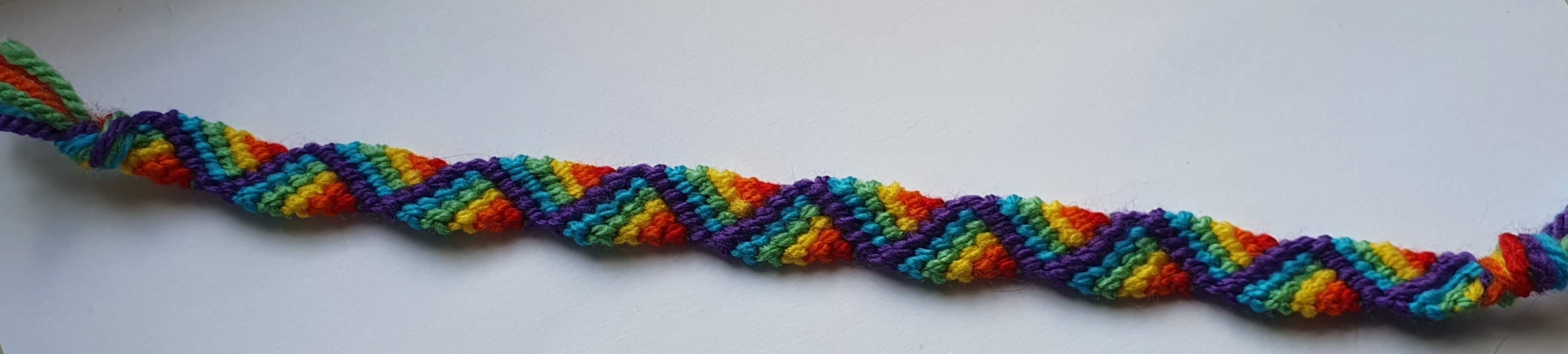 Bracelet with rainbow zigzags looking like a folded ribbon