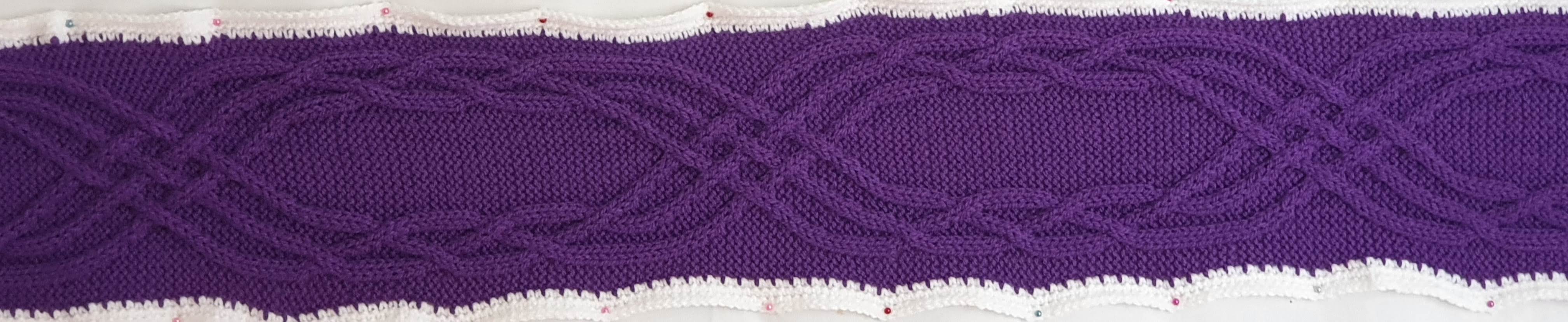 Purple with six strands in two groups of three, plaiting amongst themselves at either side, then weaving through the other group of three strands